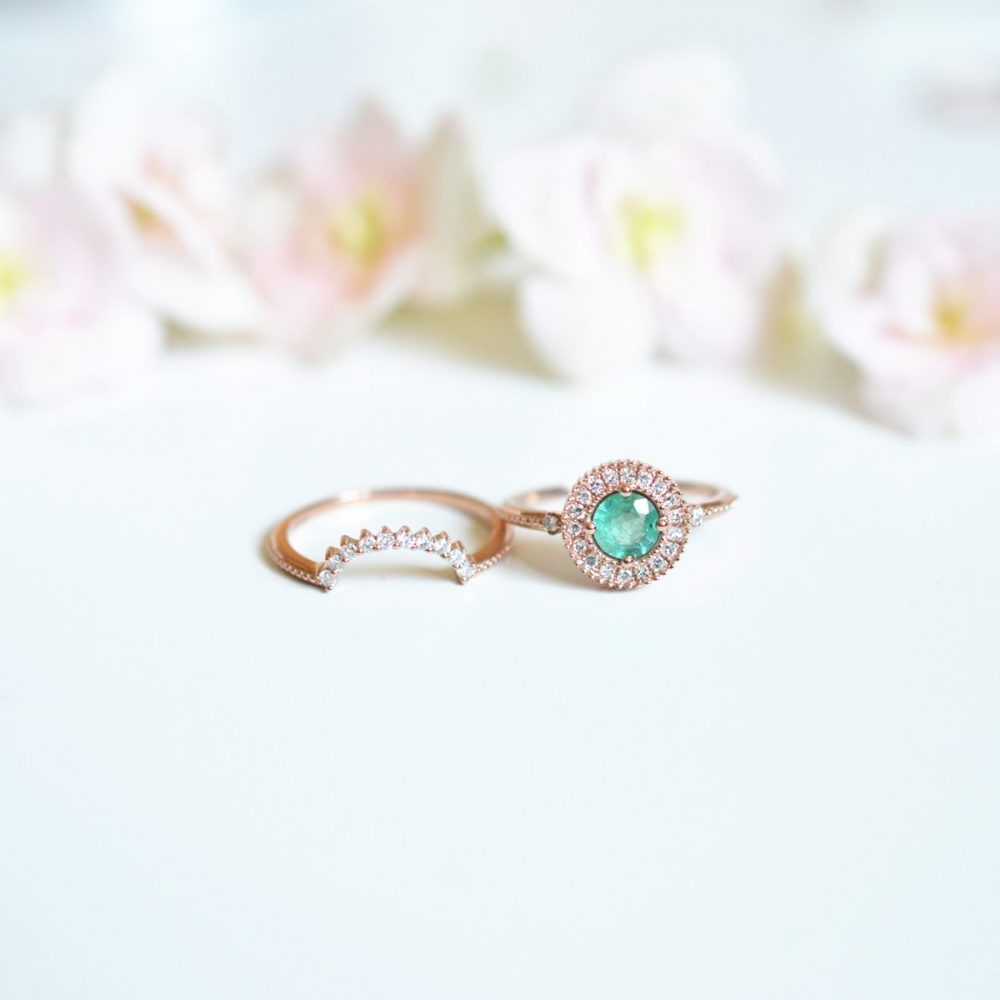 two rings together with flowers